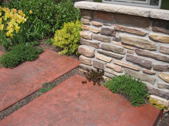Stamped colored concrete by Heidi's Lifestyle Gardens