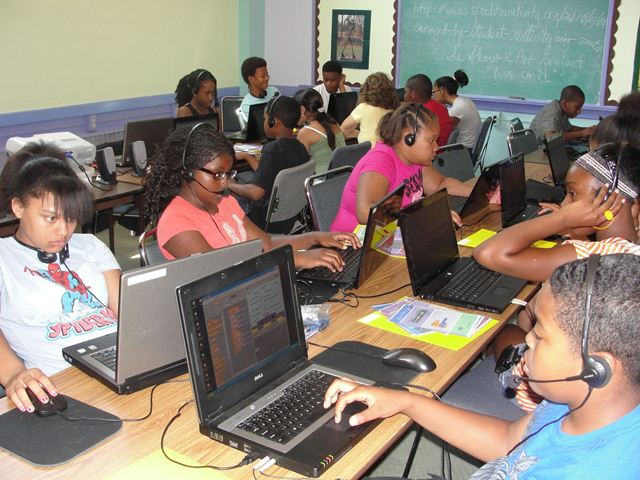 Youth using Architect design software on laptops.