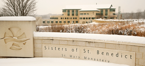 Snow covers the sign in front of St. Mary Monastery