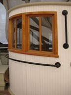 curved drop windows in pilothouse