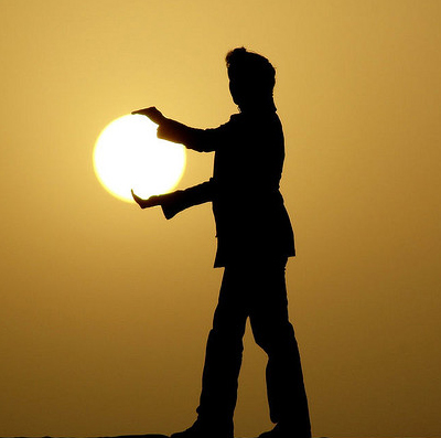 woman holding sun