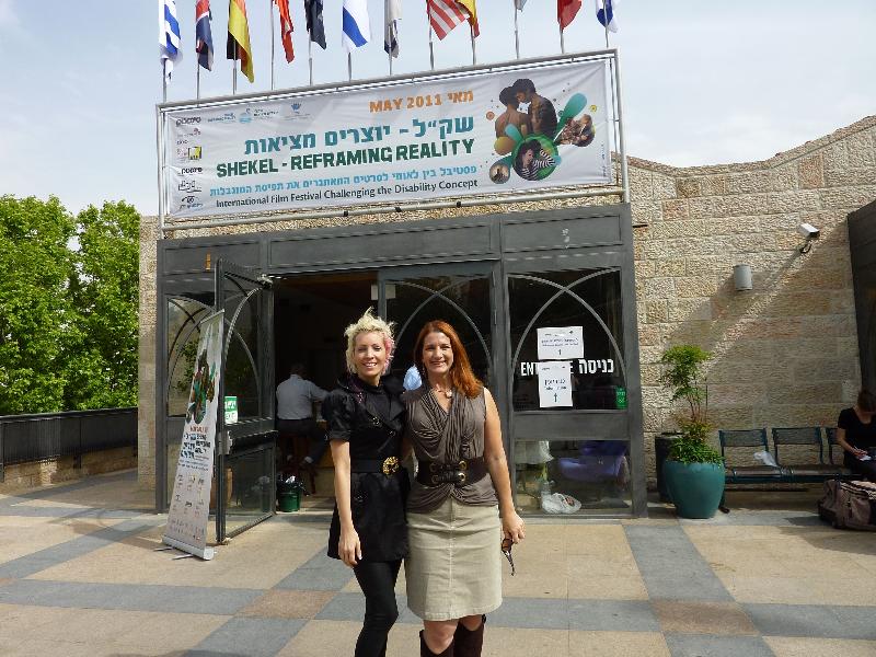 Israel Hilari and TL with Shekel banner