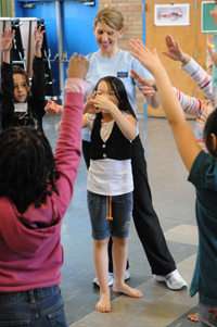 PNB teaching artist Suzanne Singla with 3rd grade students from Graham Hill Elementary (Photo by Bill Mohn)