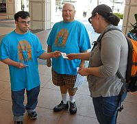 Volunteers passing out Task Force info at General Conference