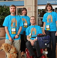 Task Force members and service dog in front of convention center