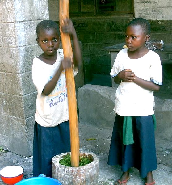 Kids pounding greens in Congo