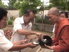 Monk receiving dana