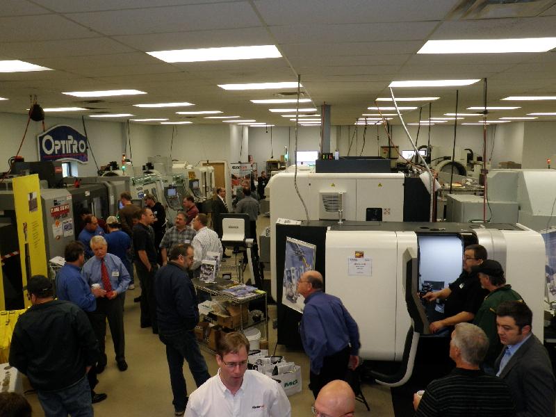 Crowds gather around different machine tools at OptiPro's Open House