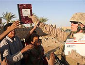 RCT 5 Marines give school supplies to Iraqi children