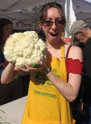 volunteer with a giant cauliflower
