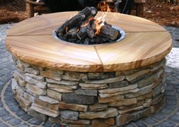 Cultured stone firepit by Stone Garden