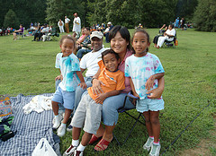 family attending summer concert