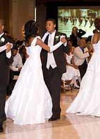 young male and female dancing in formal attire