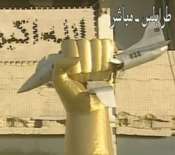 Qaddafi's Golden Fist Sculpture Crushing USAF Jet