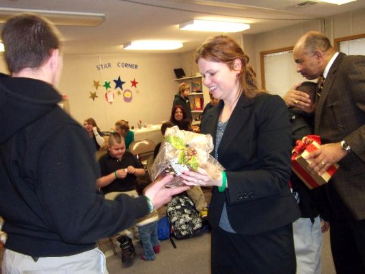 TCP studnets give presents to fellow & judge