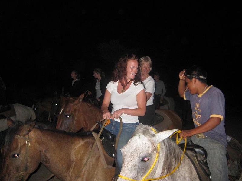 Guests enjoying conversation with Cesar - head cowboy - on Moonlight ride