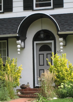 front door with arch and cool brackets