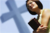 woman, cross and Bible