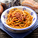 Bowl of spaghetti with amatriciana sauce.