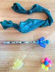 variety of fidgets including stretchy band, pencil with spinner bolt, and textured balls
