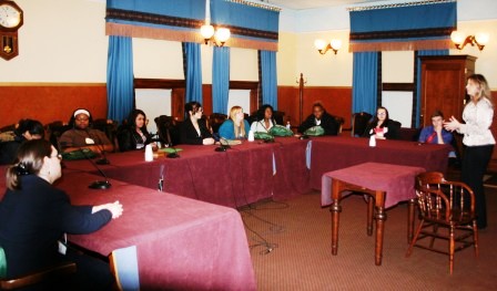 Participants discuss a bill with a legislative aide.