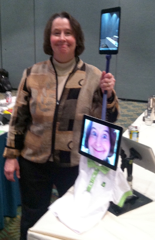 Photo of Dr. Willkomm smiling with iPads.