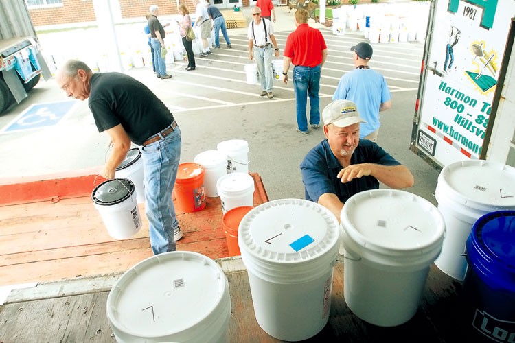 Packing buckets.photo by Mark Large. TDT. 6-22-13