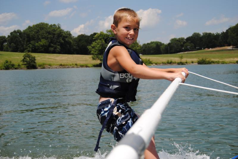 Boy water skiing at Camp John Knox
