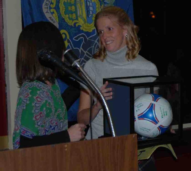 Kim accepting 2012 coach award