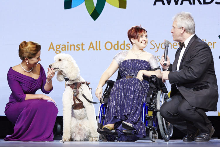 FEI Awards 2014 - Against All Odds: Sydney Collier (USA) with her service dog Journey and HRH Princess Haya talks to retiring FEI Endurance Director Ian Williams, co-Master of Ceremony for the evening