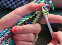 Girl knitting at Summer Camp