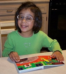 Photo of child reading a Seedlings book