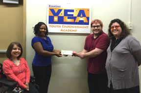 KYEA staff and Maximus rep with grant check