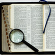 Bible and Magnifying Glass