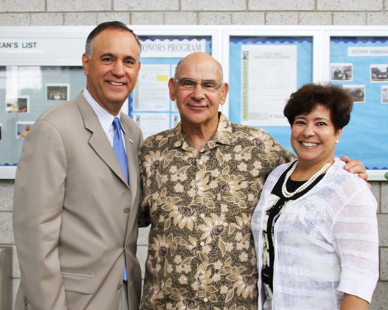 Steven Delgado (center) stands with Hostos President F�lix V. Matos Rodr�guez and Senior Vice President of Administration and Finance Esther Rodr�guez-Chardavoyne on July 30 in the A-Atrium during a celebration of Delgado's long career at the College.