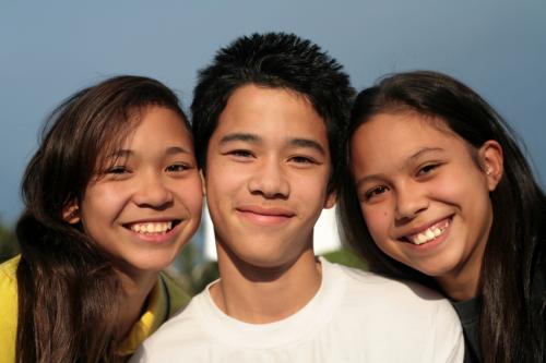 Three smiling teens